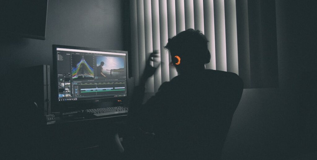 Creator working at a computer on an AI video production workflow