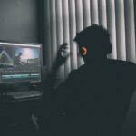 Creator working at a computer on an AI video production workflow