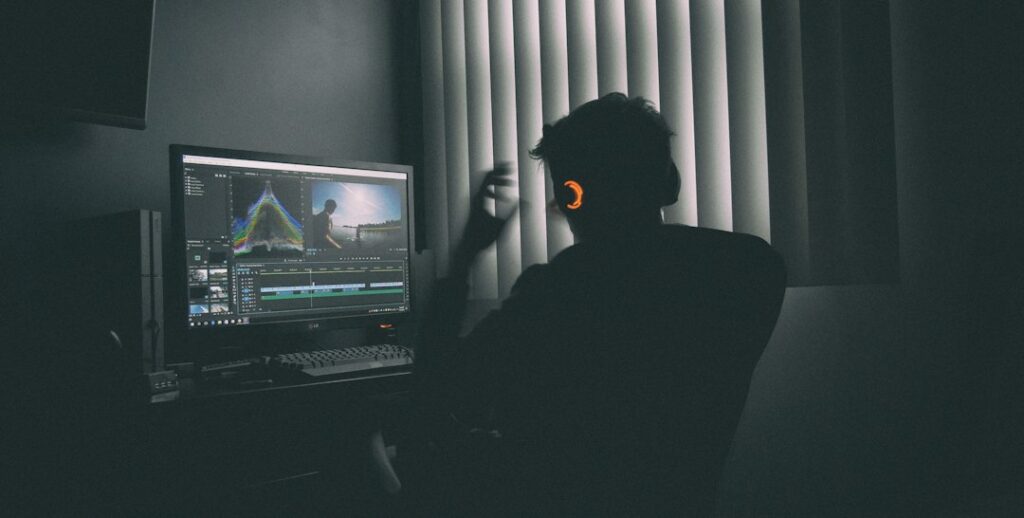 Creative professional working at a computer for an AI ad creative workflow guide