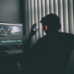 Creative professional working at a computer for an AI ad creative workflow guide
