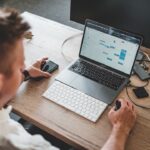 Laptop workspace for comparing AI assistants for everyday computer tasks