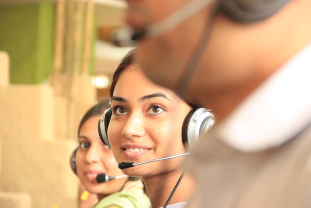 Customer service representatives wearing headsets for an AI receptionist alternatives guide