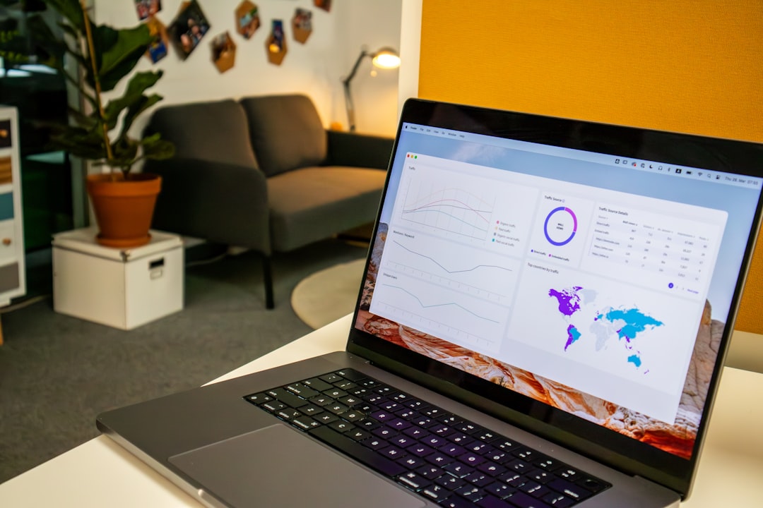 Laptop workspace with analytics used for AI-assisted small-business productivity