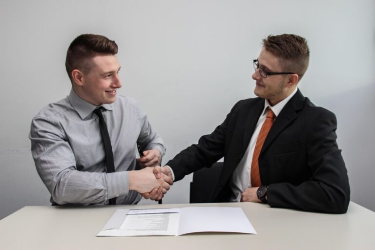 Business partners shaking hands to represent affiliate and referral programs