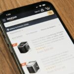 Smartphone and workspace for an Amazon seller product research guide