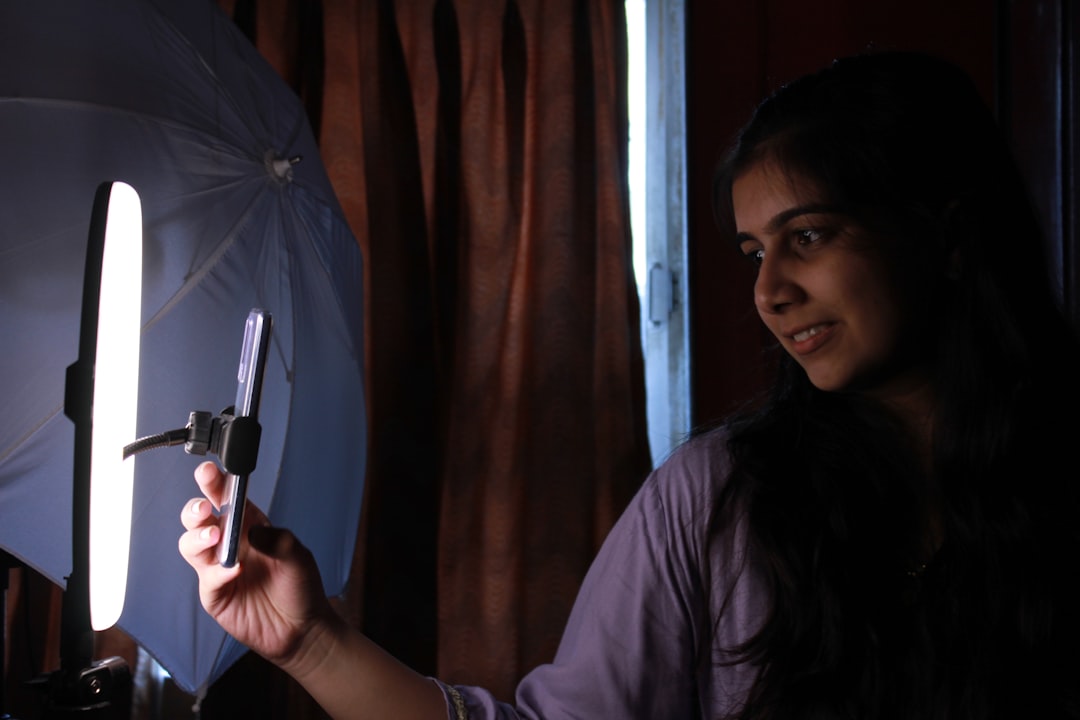 Content creator using studio lighting for video recording