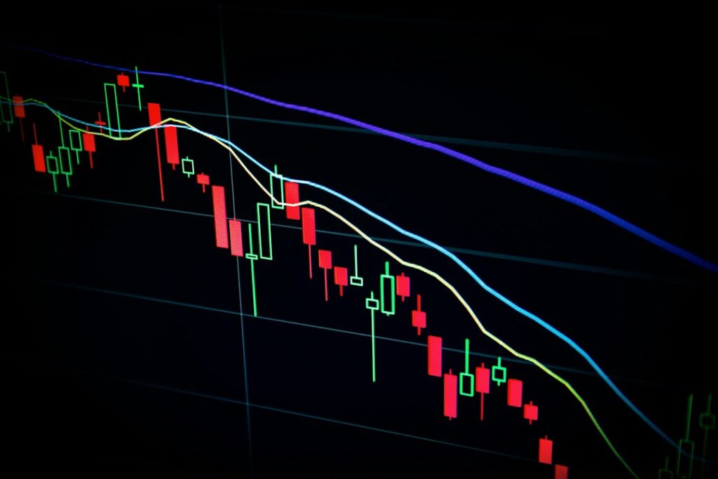 Market charts on computer screens for a crypto trading automation guide
