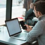 Laptop and smartphone for a customer messaging automation guide