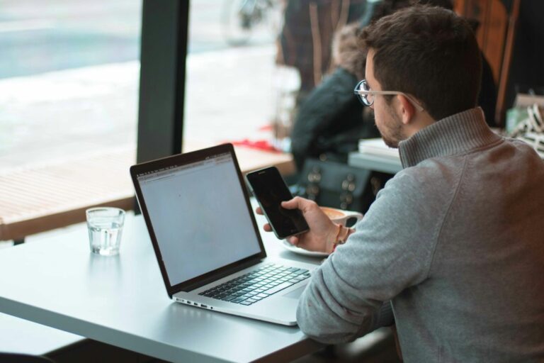Laptop and smartphone for a customer messaging automation guide