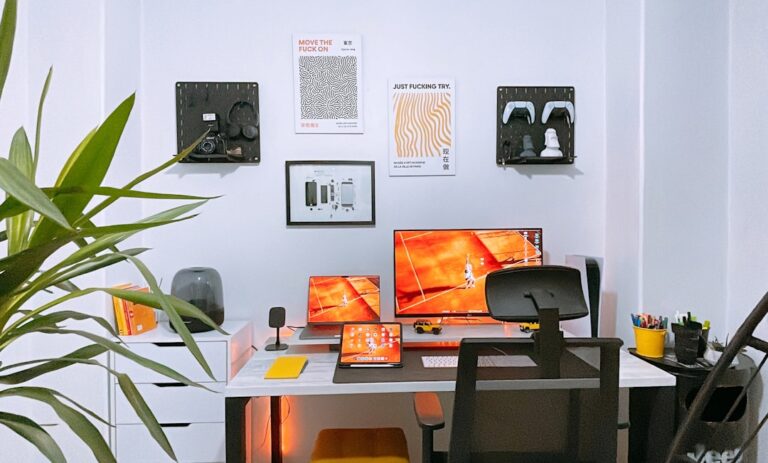 Dual-monitor desk setup with keyboard and computer accessories for a productive home office
