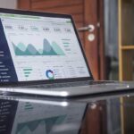 Laptop displaying marketing analytics for a sales funnel and email campaign