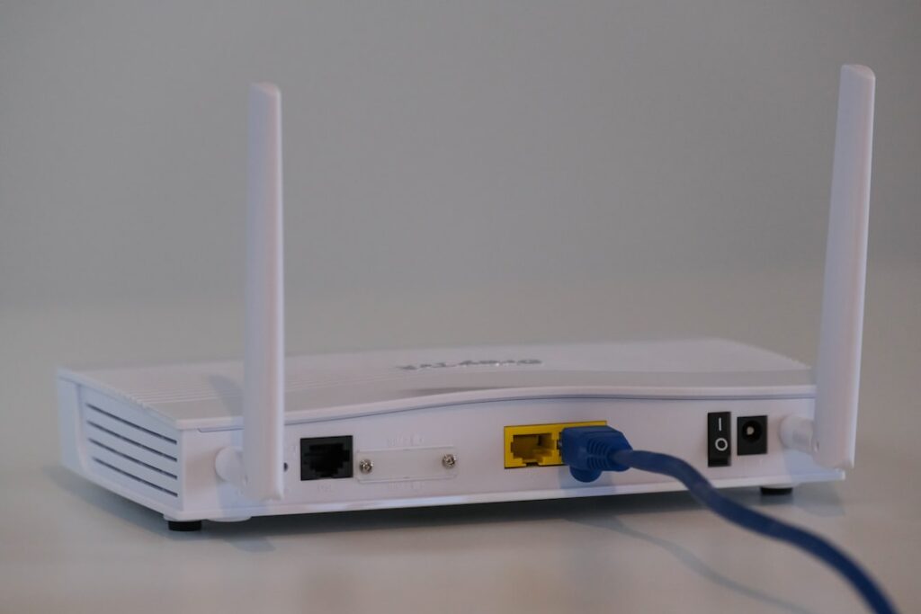 Home broadband router with Ethernet cable connected for Wi-Fi troubleshooting