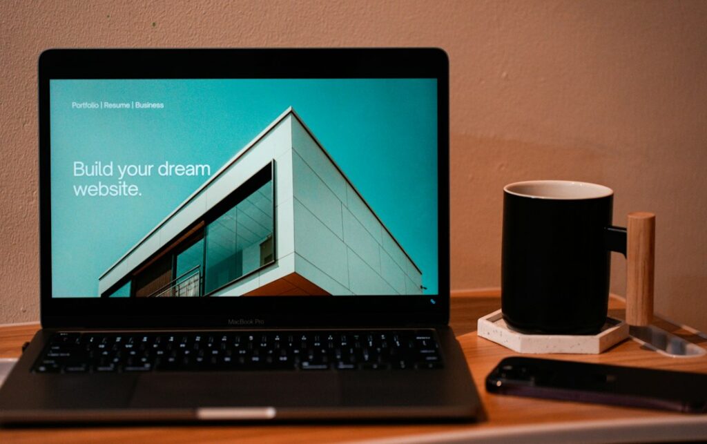 Laptop with website design workspace for a landing page funnel guide