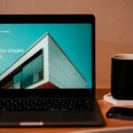 Laptop with website design workspace for a landing page funnel guide