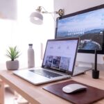 Laptop and desktop computer workspace for comparing portability and performance
