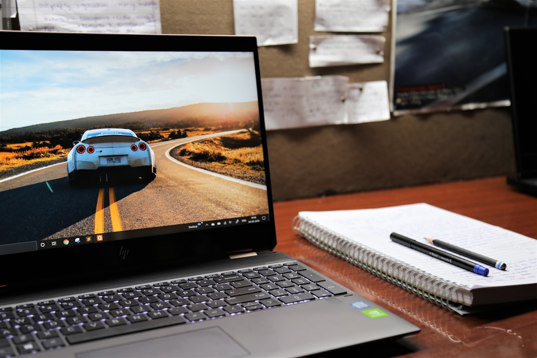 Laptop on a desk representing system configuration and Windows settings