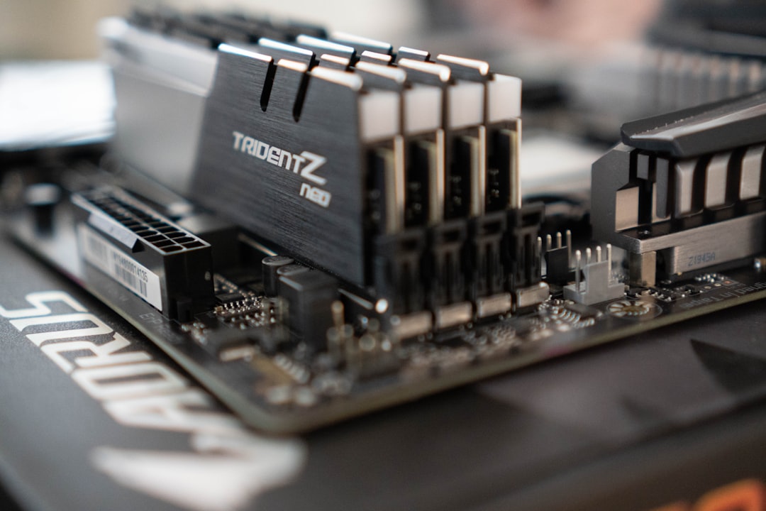 Computer motherboard and memory slots illustrating a RAM upgrade for Windows 11