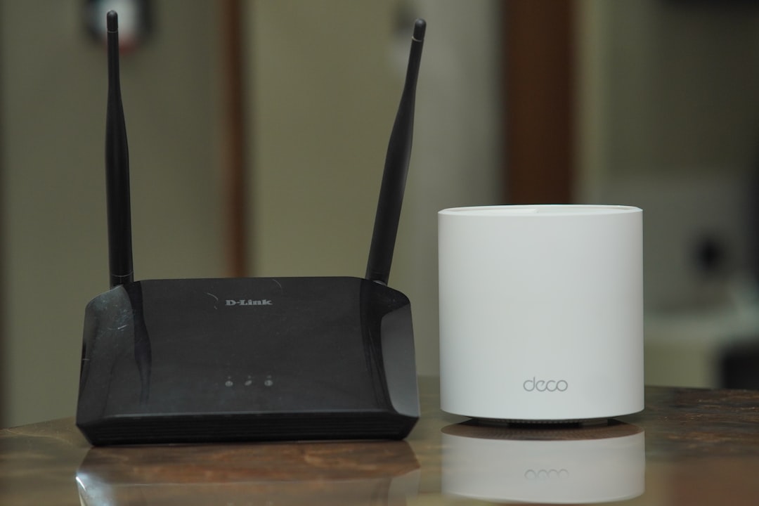 Traditional wireless router beside a modern mesh Wi-Fi unit
