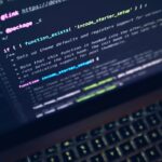 Laptop with code on screen representing Linux development with WSL 2 on Windows