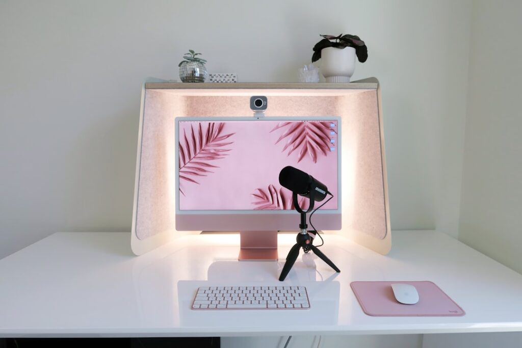 Home office desk with webcam, microphone and computer for professional video calls