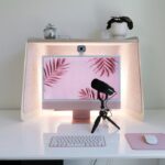 Home office desk with webcam, microphone and computer for professional video calls