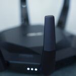 Wi-Fi router with antennas and status lights used for home network troubleshooting