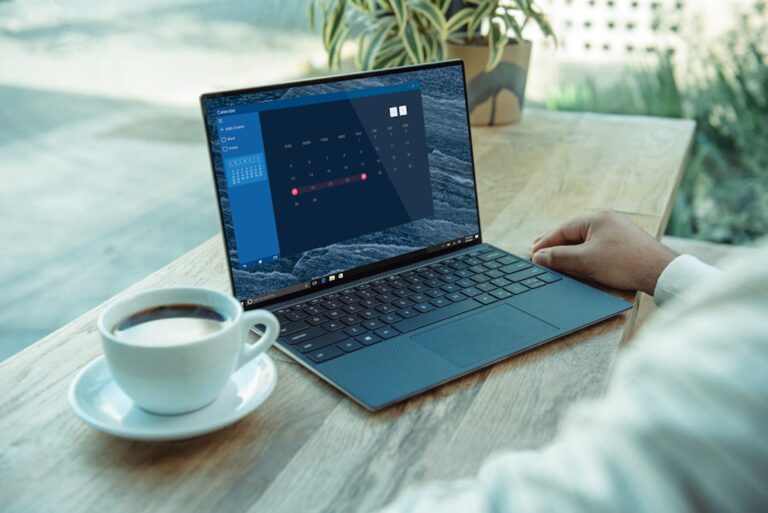 Person using a Windows laptop for multitasking and window management