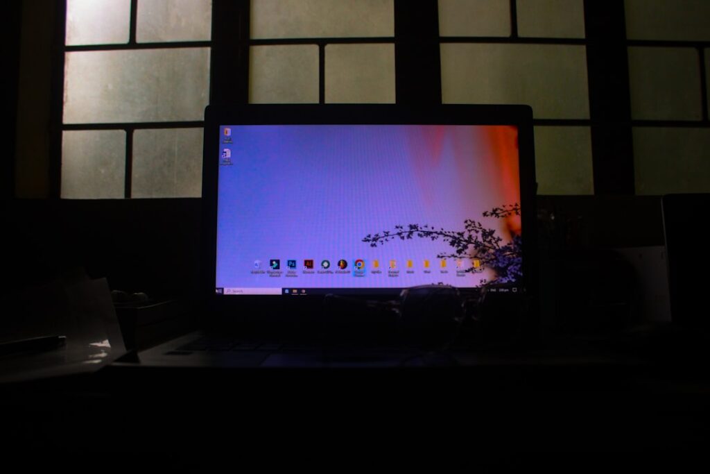 Laptop prepared for a Windows 11 upgrade with Windows Update and backup steps